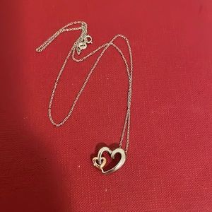 10k white and rose gold heart with small diamond on a 14 k chain